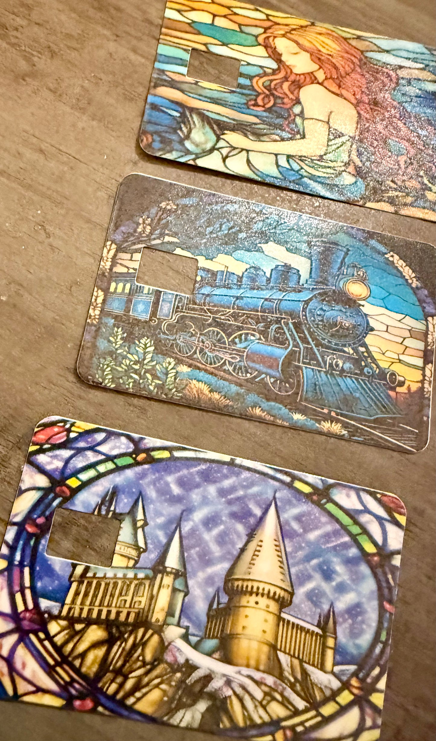 Wizarding-Themed Stained Glass Debit Card Skins | Magical Castle, Enchanted Train & Mermaid Designs