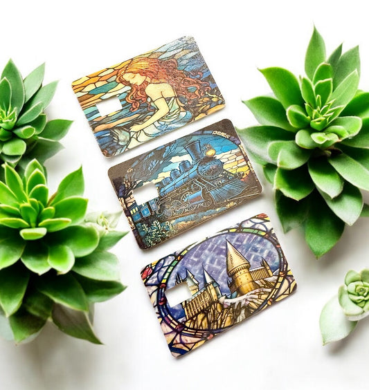 Wizarding-Themed Stained Glass Debit Card Skins | Magical Castle, Enchanted Train & Mermaid Designs